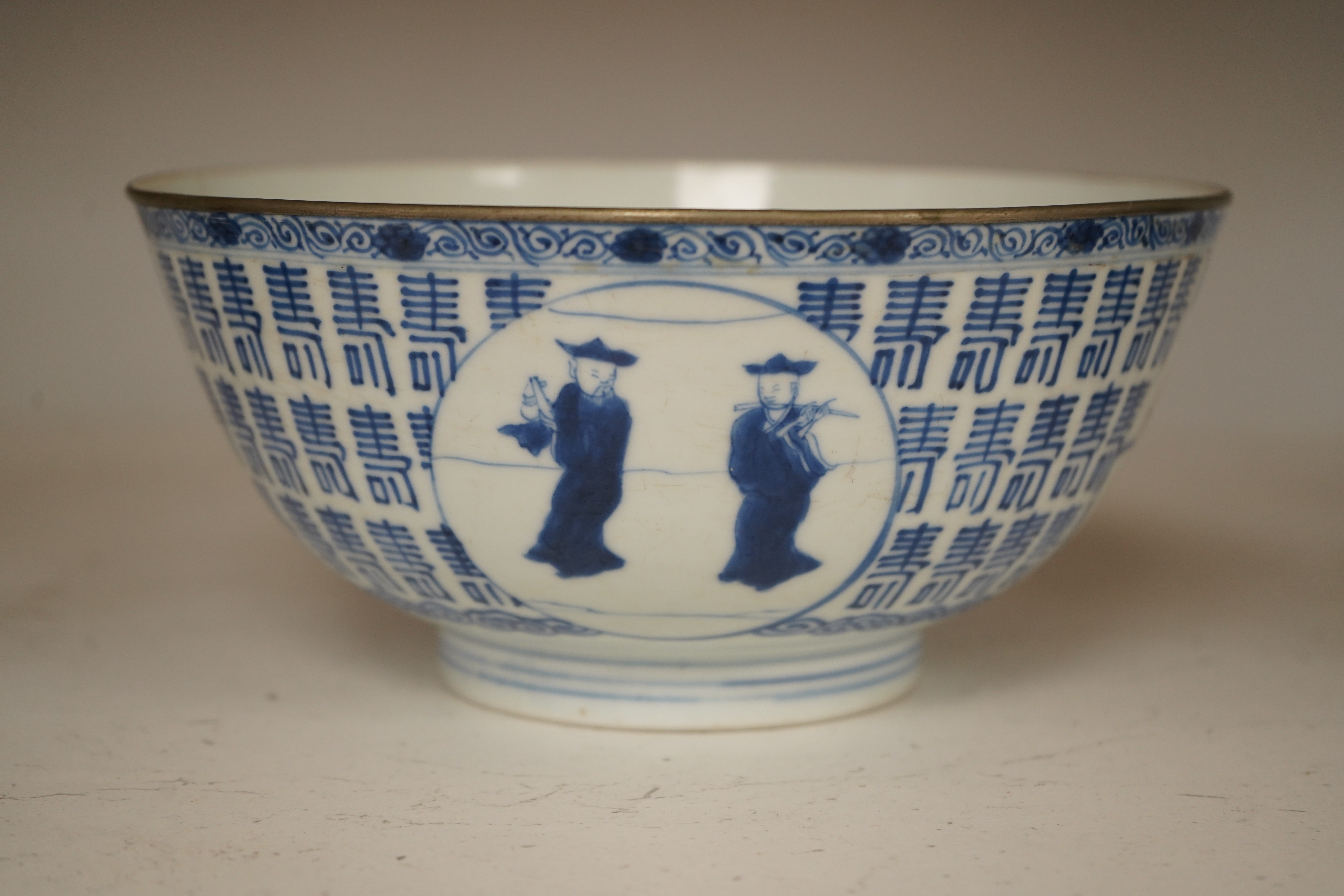 A Chinese blue and white ’Hundred Shou’ bowl, Qing dynasty, 20cm in diameter. Condition - cracked